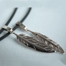 Native American eagle feather pendants of white gold
