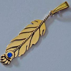Gold and sapphire eagle feather and bear paw pendant Manidoo