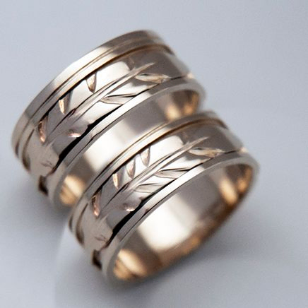 First Light of Dawn white gold eagle feather wedding rings