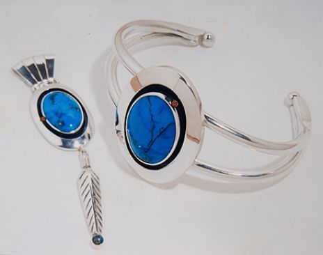 Native American turquoise and silver set of matching pendant and bracelet