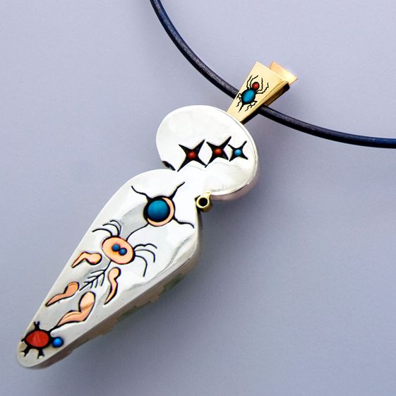 Back of the pendant Endawi-giizhig demonstrating graphic overlay design of the Ojibwe story of Sky-Spirit Woman