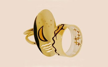 Ojibwe-inspired gold wedding rings featurin the Fishere Star constellation
