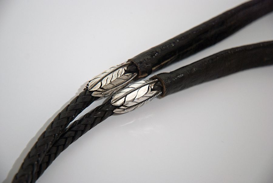Detail of eagle feather decoration bolo cord 