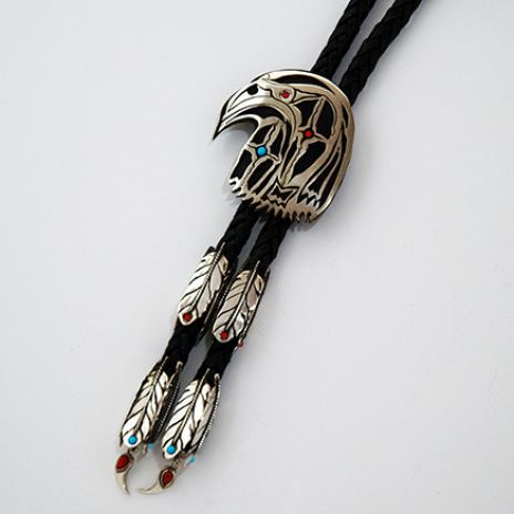 Sacred Story of the Thunder Hawk bolo tie with an elaborate eagle feather cord